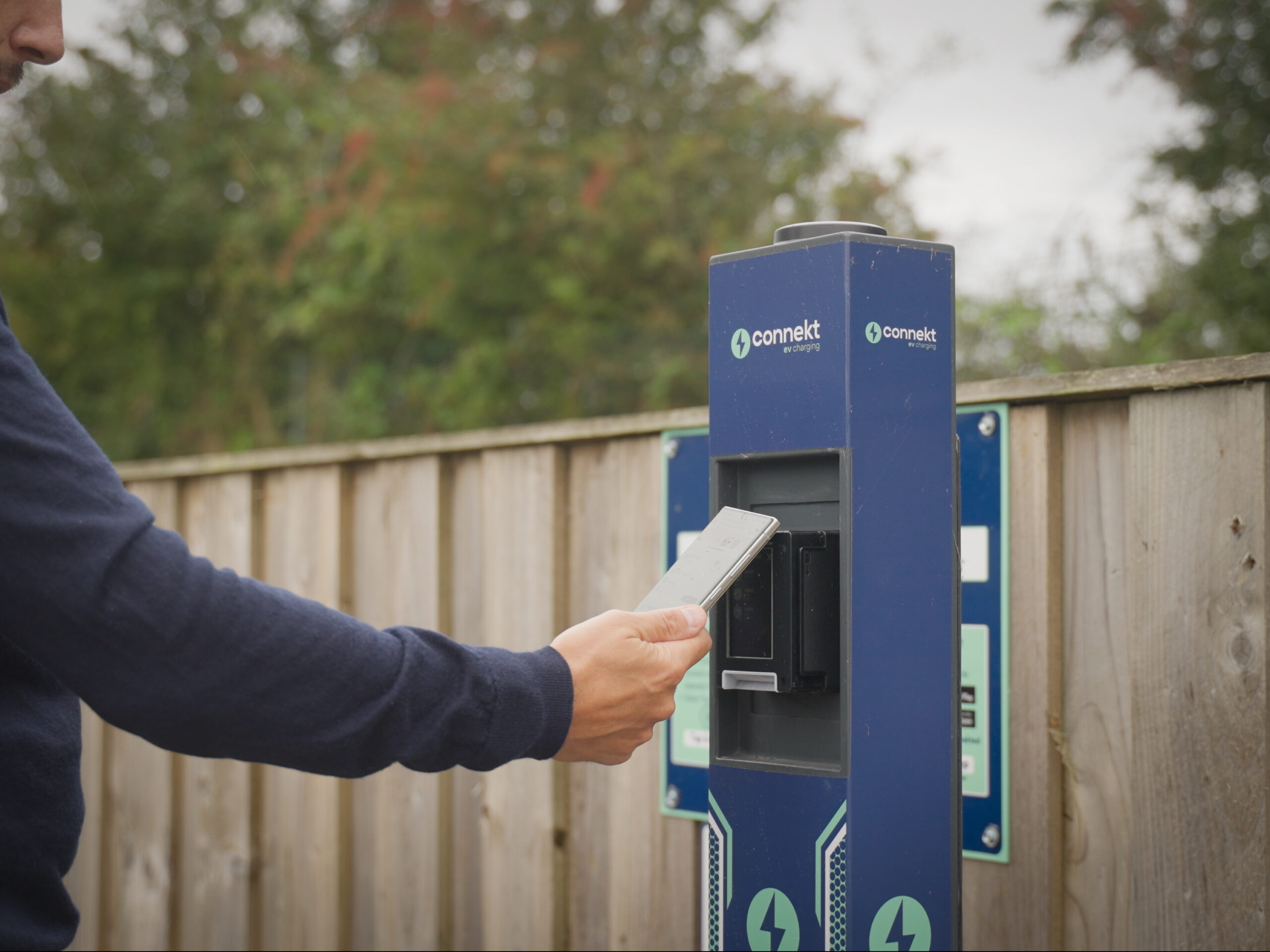 Guest using an EV charger at a Verdant Leisure holiday park